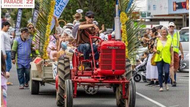 Image © Claude Thérond – used with permission Vintage red tractor with nativity scene float in Santa Parade, Pohutukawa Coast Christmas