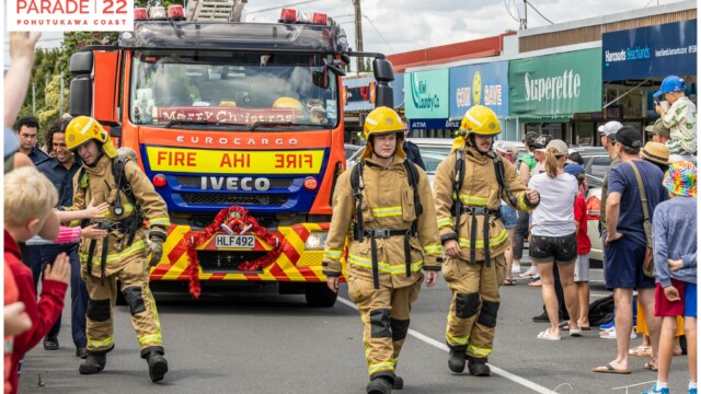 Image © Claude Thérond – used with permission Fire truck and firefighters in Santa Parade, Pohutukawa Coast Christmas celebration