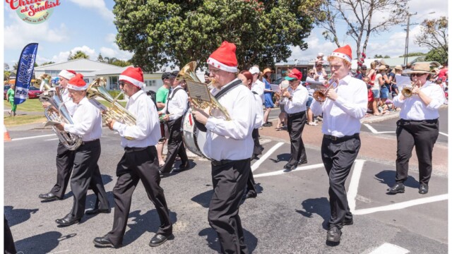 Image © Claude Thérond – used with permission Brass band marching Christmas Santa Parade Pohutukawa