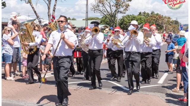 Image © Claude Thérond – used with permission Brass band marching Christmas Santa Parade Pohutukawa